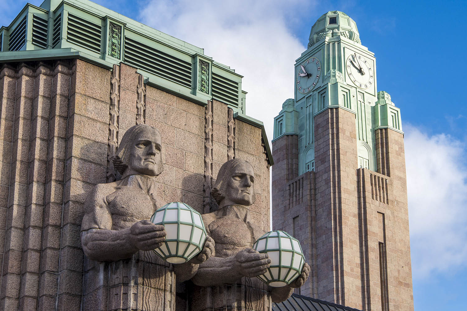 Helsinki railway station stone men statues